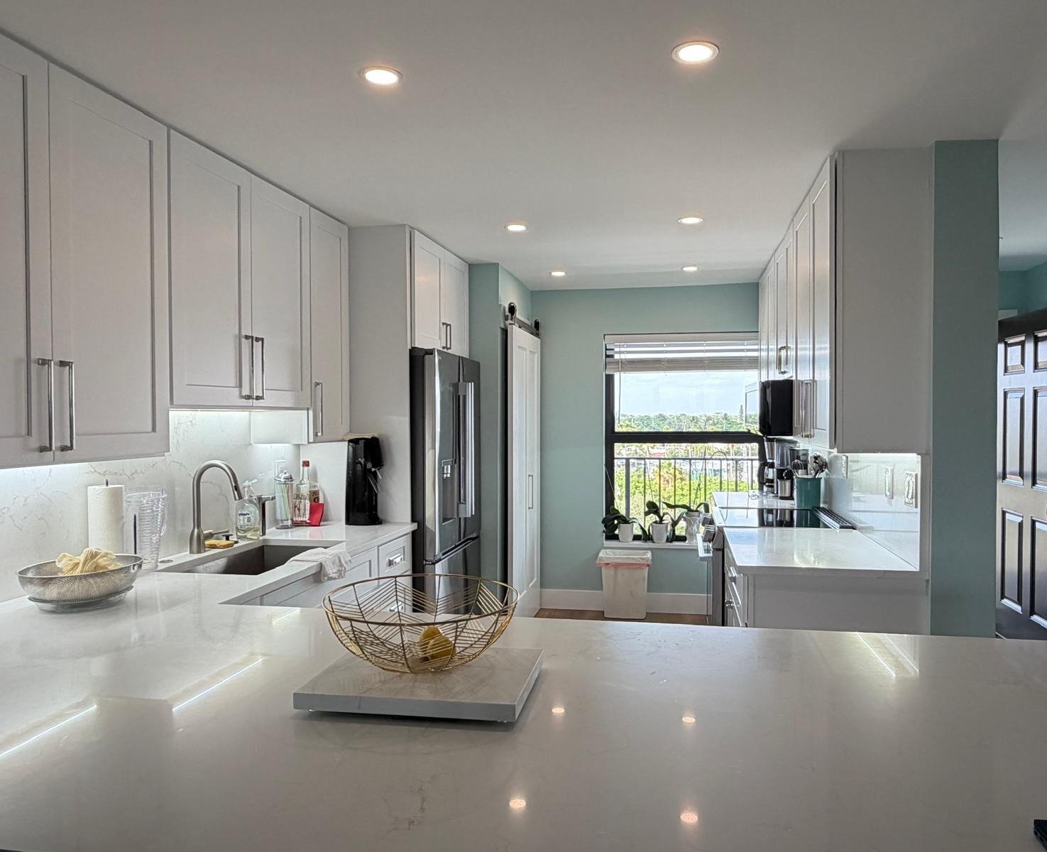 Quartz countertops and island installed in a remodeled kitchen
