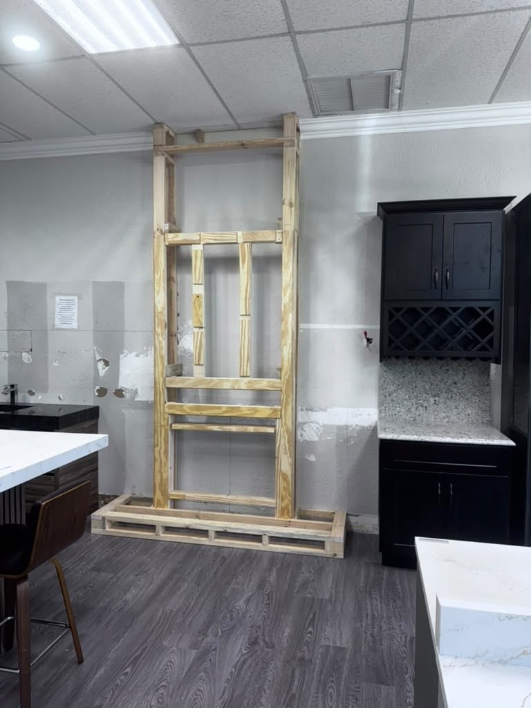 Dark shaker bar cabinets with a built-in wine rack and stone counter